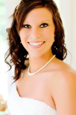 Bride smiling before walking down the aisle.