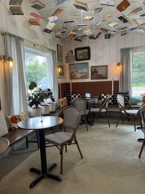 Seating area to eat snacks that are for sale (cookies and bread slices).