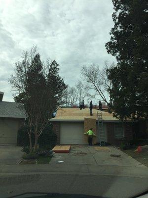 Wooden shingles removed and new sheeting going on.