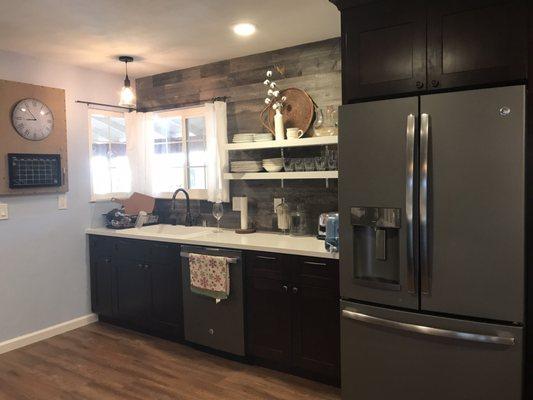 Floating shelves, reclaimed wood back splash from Stikwood