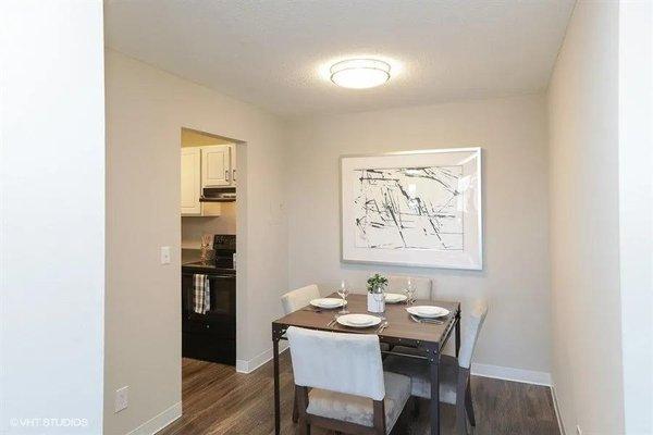 Separate dining space in our updated one-bedroom. Dining room is close enough to the kitchen to socialize with guests while preparing dinner