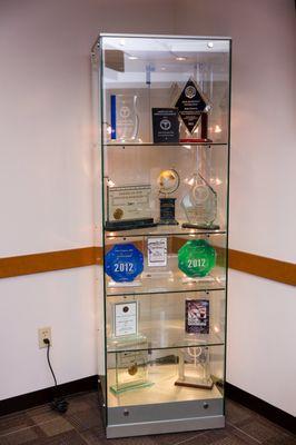 Some of Dr. Goosey's honors and awards are displayed in the waiting area.