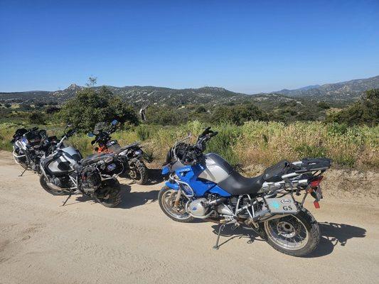 Big adv bikes on trails.