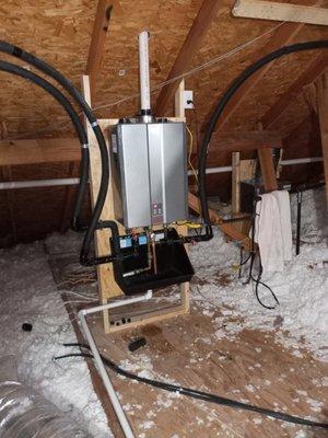 Propane tankless water heater in attic.