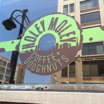 Window graphics for Holey Moley Doughnuts in the Third Ward.