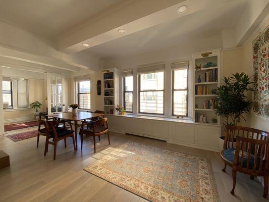 Built-in book shelf with radiator cover made by Gothic Cabinets team