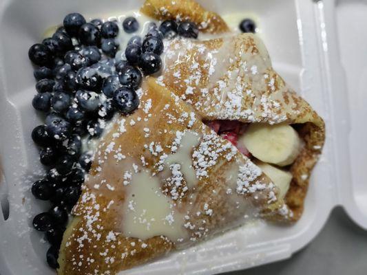 Crepes with banana, blueberries, strawberries, Nutella and lechera