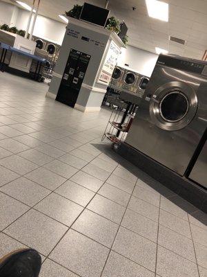 Inside the laundromat. If you can see the sign says Last Wash 9:00 It's a Thursday