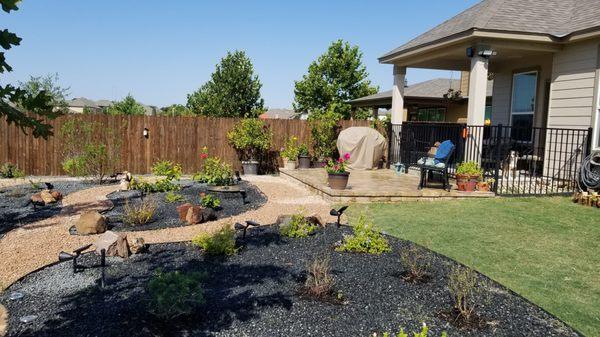 Taken from the middle of the yard near the side fence toward our stone deck and house.