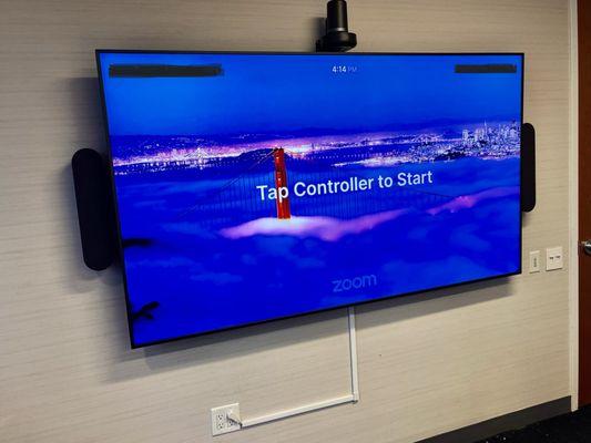 85" commercial tv equipped with a Logitech Rally Plus videoconferencing system for maximum efficiency of a zoom room.