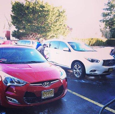 Our employees hand-washing vehicles.