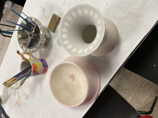 Dog bowl and flower vase before being fired (pottery not plaster.)