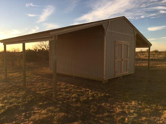 Storage shed with additional outside storage.