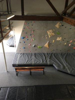 Slab wall and mats for classes. Photo taken from lounge area upstairs.