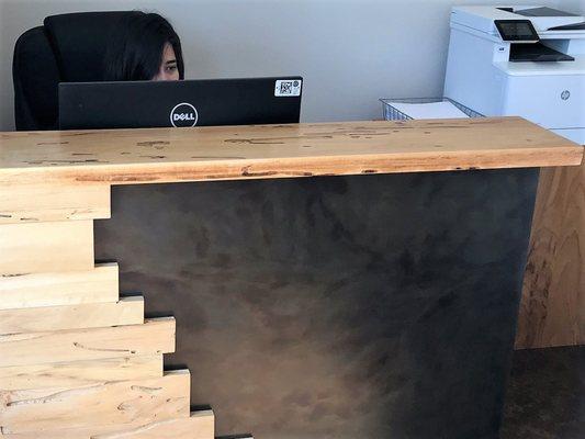 Solid wood and steel reception desk.  We thrilled with the design and the final product.