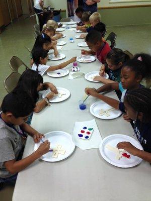 Kids enjoy crafts at Vacation Bible School during the summer.