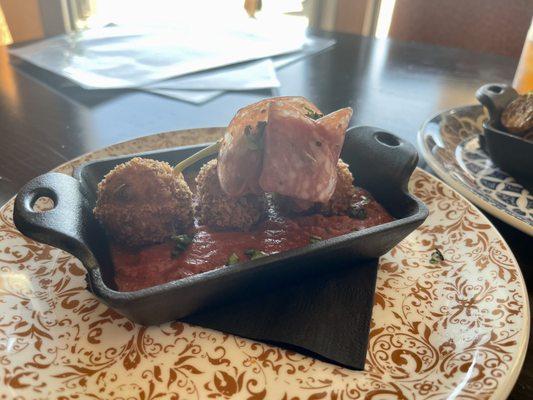 Arancini with harissa tomato sauce