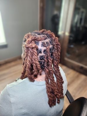 Two stand twist done one traditional locs