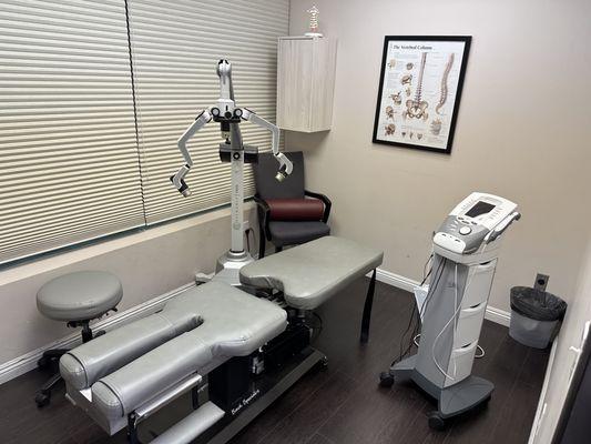 Treatment room seen with an Erchonia FX635 Laser system and Chattanooga Electric stimulation/ultrasound system