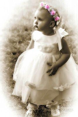 Wedding photography. Ring bearer. Sepia with some color elements.