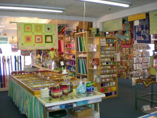 View from the cutting table, looking toward some of the fabrics and notions.