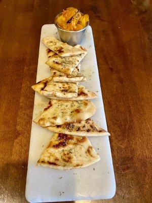 Complimentary pita with hummus  and roasted sweet peppers