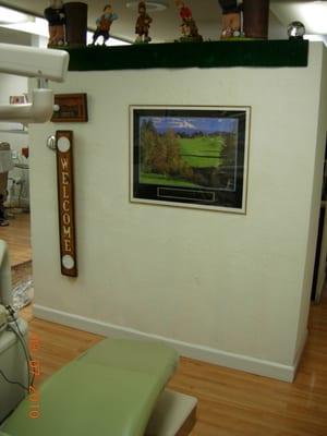 Dr. B's treatment room is filled with golf goods. Including his Hole in 1 plaques.