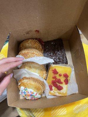 Hand pies (chocolate cream & Strawberry Rhubarb) vegan brownies, and lemon bar.