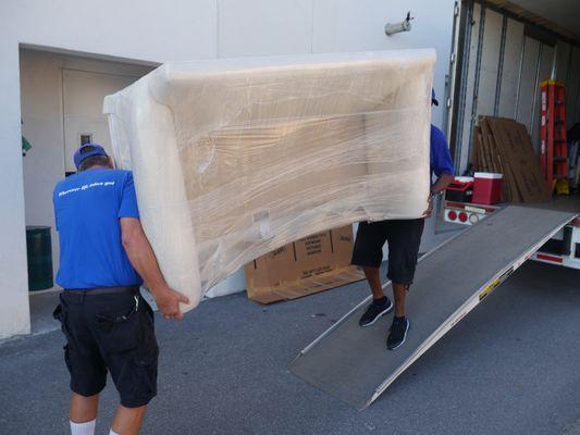 Movers moving furniture