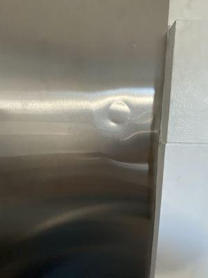 Bought 2 stainless steel sheets for my kitchen backsplash. Both sheets had huge dent.