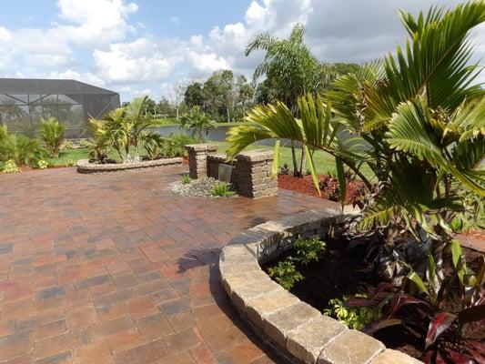 Backyard makeover with paver patio, waterfall and landscaping.