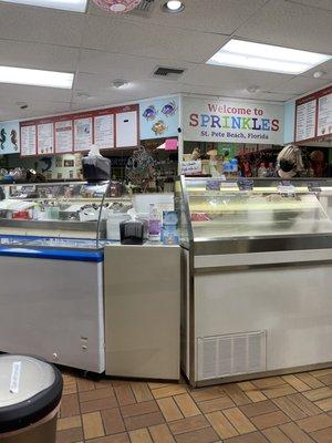 Store attendant behind the ice cream counter