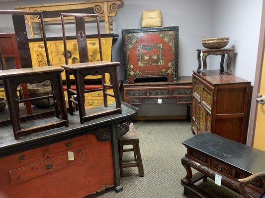 Antique furniture and paired chairs.