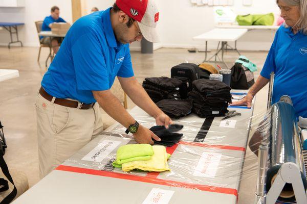 Employees folding laundry