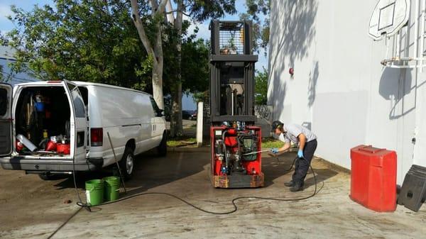 Tech working on Raymond Forklift