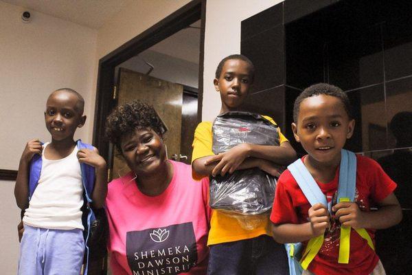 Serving generation Alpha donating backpacks and school supplies