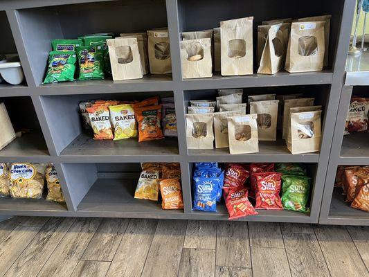 Below the counter, chips and cookies.