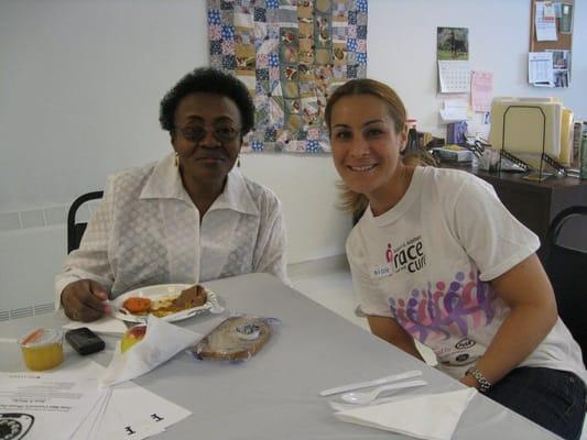 Urban Girl Squad volunteer and housing resident at Met Council's senior lunch program.