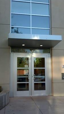 Entrance from parking lot-the elevator or stairs to the 2nd level are inside