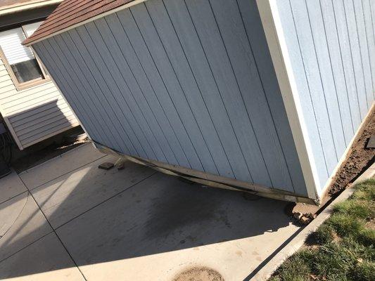 Doing great work on a very difficult shed move. He had to negotiate our Tuff-Shed through a narrow passageway between a tree & our house.