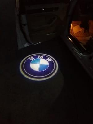 BMW ghost lights for when you open your car doors the make of your vehicle shines on the floor.