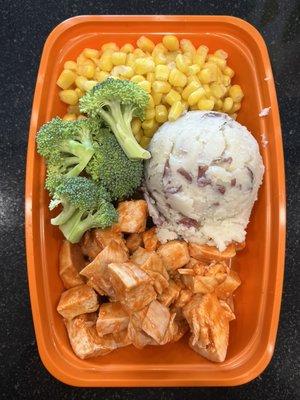 6oz Buffalo chicken breast with red potato mashed broccoli and corn.