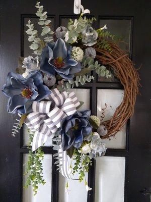 Fall Slate bluish grays. Velvet pumpkins, mixed greenery.  Could be used all season   in gray toned room. $70.00.