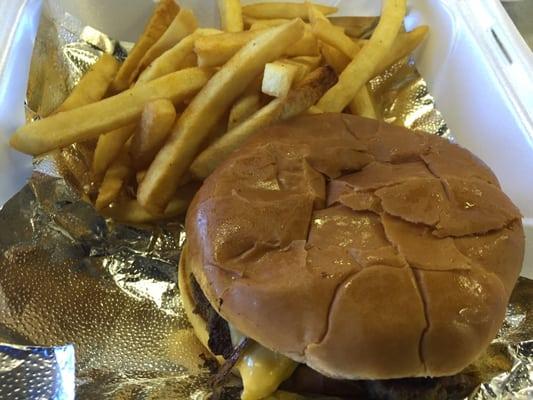 Cheeseburger comb with fries.