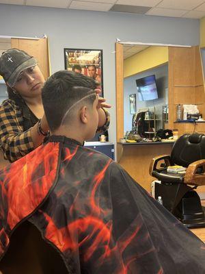 Barber Dez with my son getting a haircut