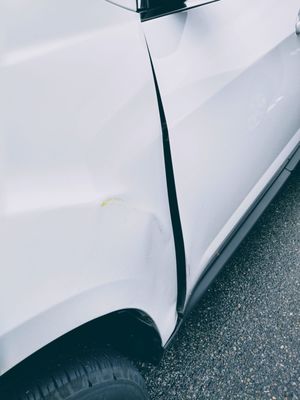 The dent that's making it hard to open my driver's door