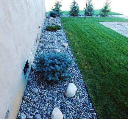 Linear elements can enhance many features of a landscape especially when tied to the architecture of the home.