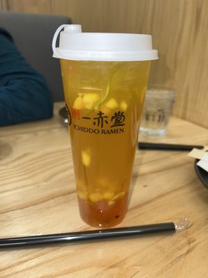 Passionfruit mango fruit tea with strawberry boba