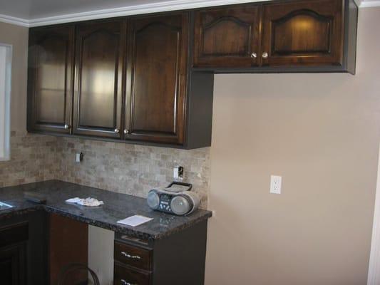 We stained and lacquered the cabinet doors and drawers and painted the styles and rails on the cabinet to give a unique look.