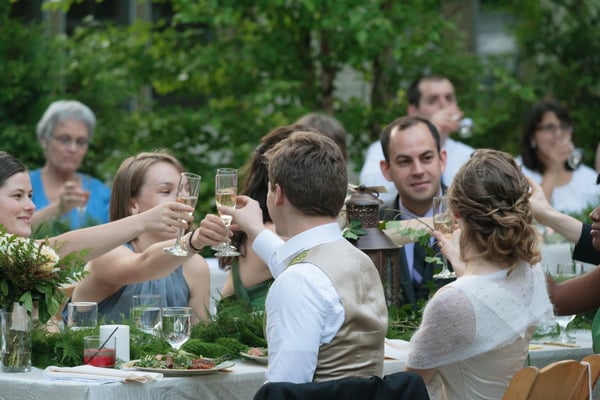 Lantern & ivy centerpiece for Midsummer Night's Dream-esque wedding (bridal bouquet on left)